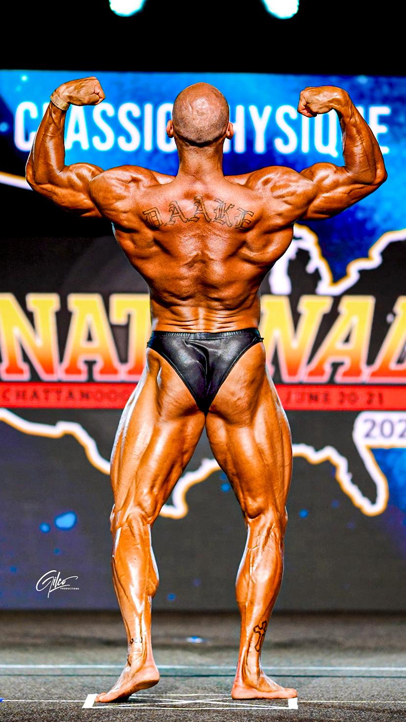 Jordan Daake rear double bicep pose